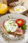 Poached Egg And Bacon On Rye Bread, Healthy Breakfast Stock Photo