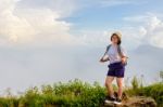 Tourist Teen Girl Poses On Mountain Stock Photo