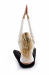 Back Pose Of Woman Doing Yoga Stock Photo