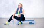 Fitness Woman Resting After Exercises In Gym Stock Photo