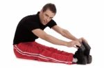 Fitness Men Stretches His Leg Stock Photo