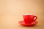 Beautiful Red Cup Of Coffee On Vintage Background Stock Photo