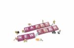 Miniature Worker Team Building Word Happy New Year On White Back Stock Photo