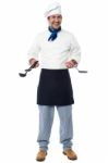 Smiling Chef With Kitchen Utensils Stock Photo