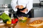 Male Chef Put Ingredient In The Glass Bowl Stock Photo