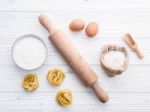 Ingredients For Homemade Pasta  Flour And Eggs On Wooden Backgro Stock Photo