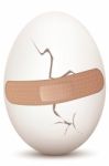 Cracked Egg With Bandage Stock Photo