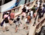 Blurred Tourist Walking On The Jetty Stock Photo