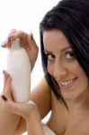 Portrait Of Woman With Lotion Bottle Stock Photo