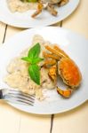 Italian Gnocchi With Seafood Sauce With Crab And Basil Stock Photo