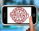 Urgent On Smartphone Showing Immediate Need Stock Photo