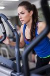 Young Woman Working Out On A Stepper Stock Photo