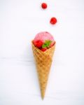 Raspberry Ice Cream In Cone With Fresh Raspberry And Peppermint Stock Photo