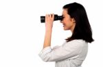 Corporate Woman Viewing Through Binoculars Stock Photo