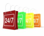 Twenty Four Seven Shopping Bags Shows Open 24/7 Stock Photo