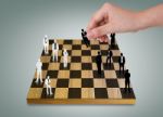 Hand Playing Chess Game Stock Photo