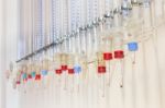 Glass Burettes Hanging At Laboratory Wall Stock Photo
