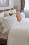 Pillows On Bed In Modern Living Room Stock Photo