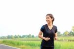 Girl Is Jogging With Sky Stock Photo