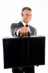 Businessman Giving His Briefcase Stock Photo