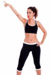 Fitness Woman Pointing Up Stock Photo
