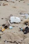 Garbage On The Beach Stock Photo