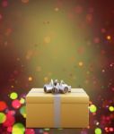 Golden Gift Box Decorated On Colorful Blurred Lights Background Stock Photo