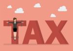 Business Woman Crucified On Tax Word Stock Photo