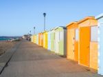 View Of Beach Huts On Seaford Promenade In Sussex Stock Photo