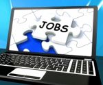 Jobs On Laptop Shows Online Application Or Hiring Stock Photo