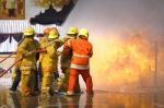 Fireman. Firefighters Fighting Fire During Training Stock Photo