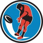 Rugby Player Kicking Ball Circle Retro Stock Photo