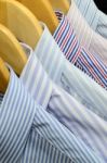 Shirts On Wooden Hangers Stock Photo