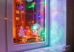 Bright Colored Electric Garland In The Window Stock Photo