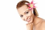 Young Beautiful Woman With Pink Flower Stock Photo