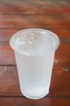 Glass Of Water On Wooden Table Stock Photo