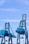 Blue Cargo Cranes At Sea Port Stock Photo