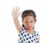 Girl Is Makes A Stop Gesture With Her Hand On White Background Stock Photo