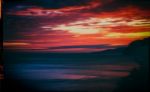 Horizontal Vintage Red Orange Vibrant Sunset Ocean Horizon Motio Stock Photo