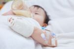 Little Asian Girl Lying  On A Medical Bed Stock Photo