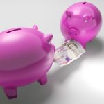 Piggybanks Fighting Over Money Showing Savings Stock Photo