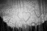 Heart And Water Droplets On Glass Stock Photo