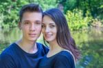 Portrait Young Couple In Love Near Water Stock Photo