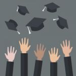Hands Of Graduates Throwing Graduation Hats In The Air Stock Photo