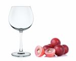 Empty Wine Glass With Red Grape Isolated Stock Photo