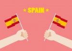 Spain National Day With Hands Holding Up Spain Flags Stock Photo
