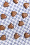 Chocolate Hearts On Fabric Stock Photo