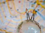 Miniature Traveller Or Backpacker Stand On Globe Of Glass And Ma Stock Photo