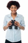 Smiling Afro American Woman Holding Binocular Stock Photo