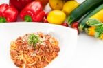 Spaghetti With Bolognese Sauce And Fresh Vegetables On Backgroun Stock Photo